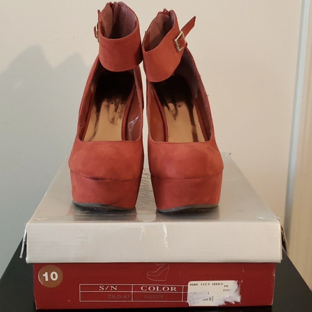 Breckelle's Rust orange platform/wedged heel, suede shoe with ankle strap.